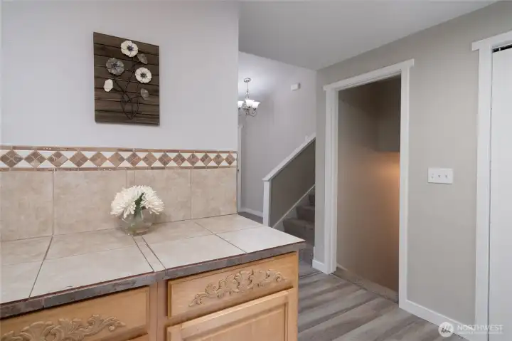 Doorway off kitchen to the downstairs bedrooms and half bathroom.
