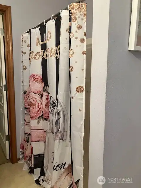 Full shower as well in Primary bathroom. Walk in closet behind, not shown in photo.