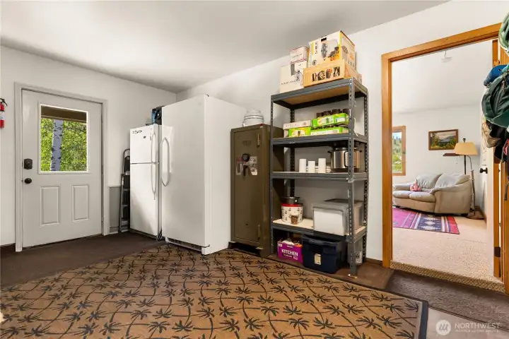 Mudroom, backdoor and entrance to bonus room