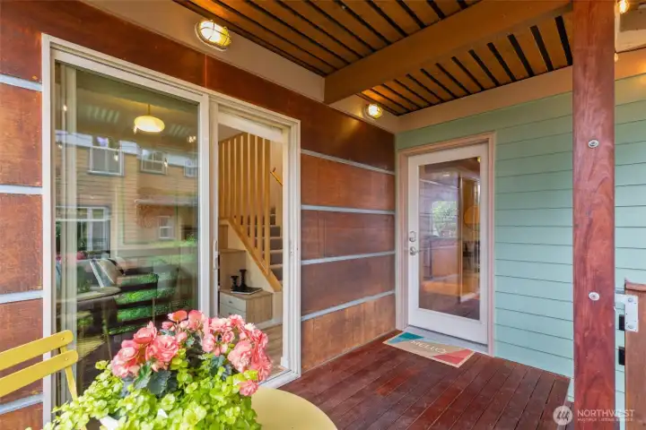 Front door is adjacent to the sliding glass door off the large den space making the perfect work from home setup.