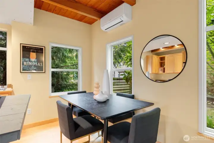 Windows wrap around all sides of the home. Ductless Mini-Split on the main level for cool AC in the summer and a warm hug in the winter.