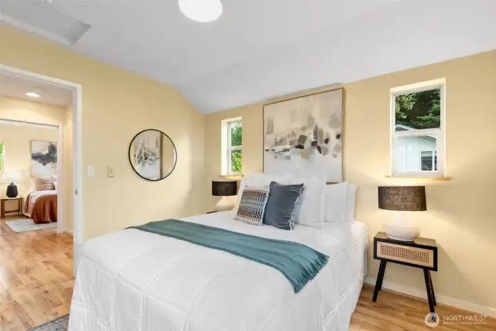 Second upstairs bedroom that could easily double as a primary bedroom given the gorgeous walk-in closet with custom shelving.