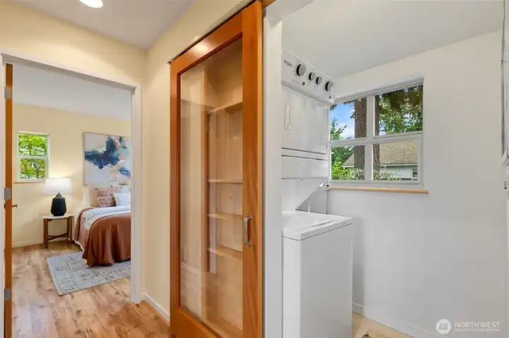 A dedicated laundry room with space for a hamper and a side shelf for all your supplies located between both bedrooms so the bedrooms do not share a wall.