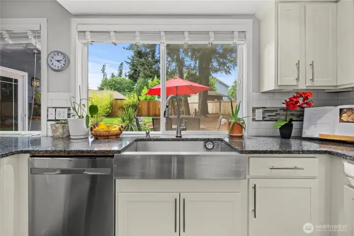 Kitchen offers a lovely view of the back yard