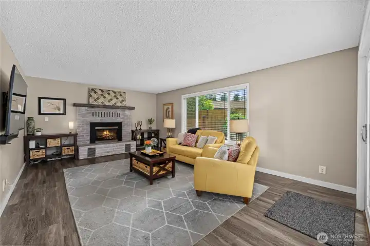 Family room off the kitchen, cozy gas fireplace and direct access to large deck and back yard