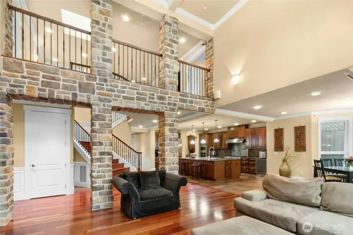 Grand living room with an open second-floor overlook, creating a stunning sense of space and light.