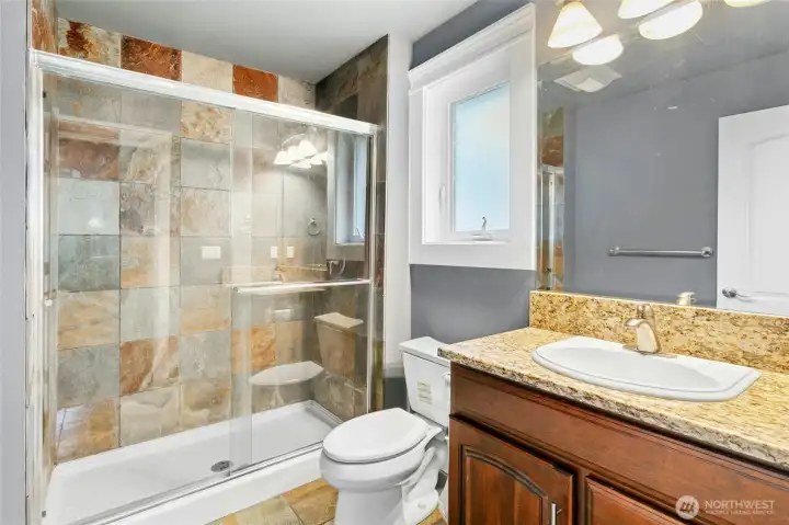 En-suite bathroom serving the third bedroom, impeccably maintained and designed for privacy and   comfort.