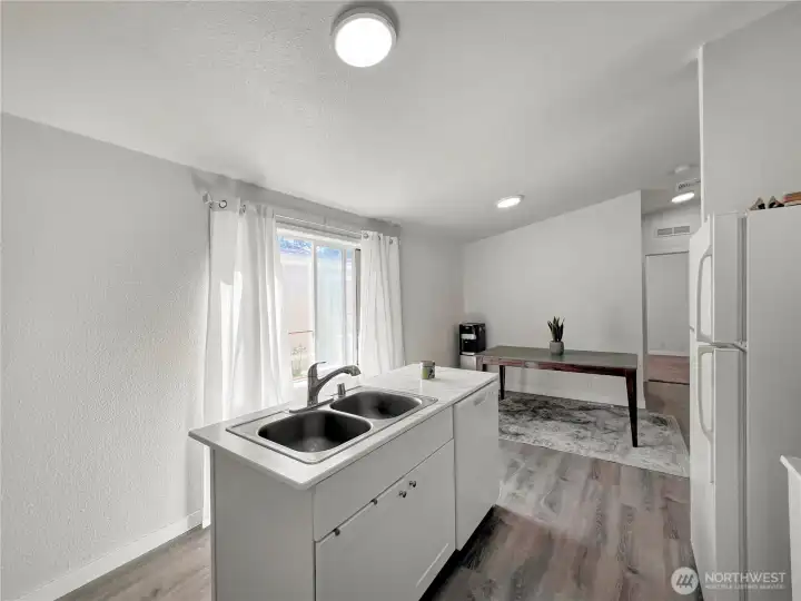 Kitchen island has granite countertops, stainless steel double sink and dishwasher Kitchen island has granite countertops, stainless steel double sink and dishwasher