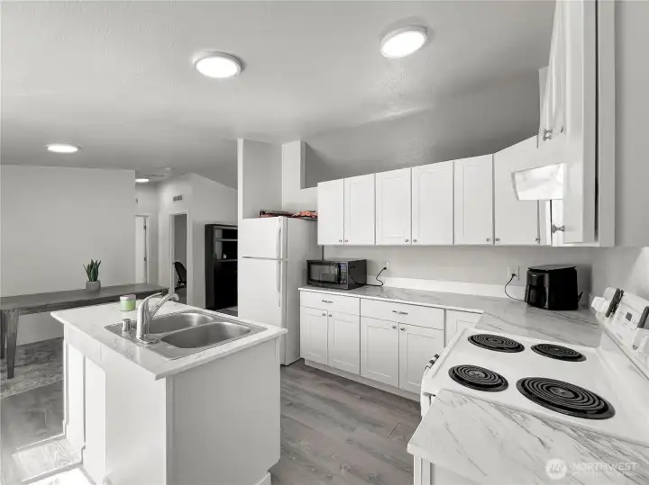 Stunning view of the spacious dining area and beautiful kitchen countertops. Stunning view of the spacious dining area and beautiful kitchen countertops.