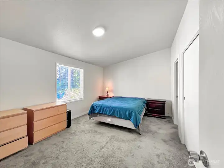 Primary bedroom with walk-in closet and private bathroom Primary bedroom with walk-in closet and private bathroom