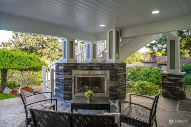 The spacious covered ADU patio offers a cozy retreat with its charming fireplace, perfect for relaxing evenings or entertaining guests. The patio's thoughtful design and comfortable ambiance make it an inviting space to enjoy the outdoors year-round.
