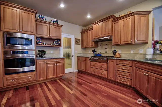 Chef's Kitchen! Granite countertops, stainless steel appliances, amazing gas cooktop! Laundry room off the kitchen