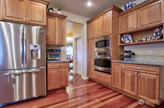 Microwave over oven, great space for a coffee bar! Garage entry, view to the formal dining rm