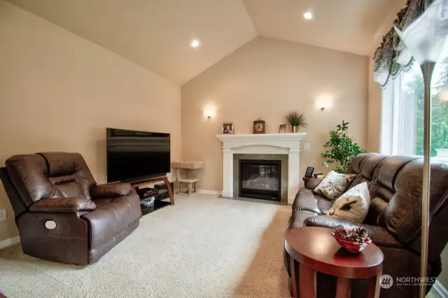 Cozy living room with gas log fireplace! Beautiful view of the mountain and surrounding woods