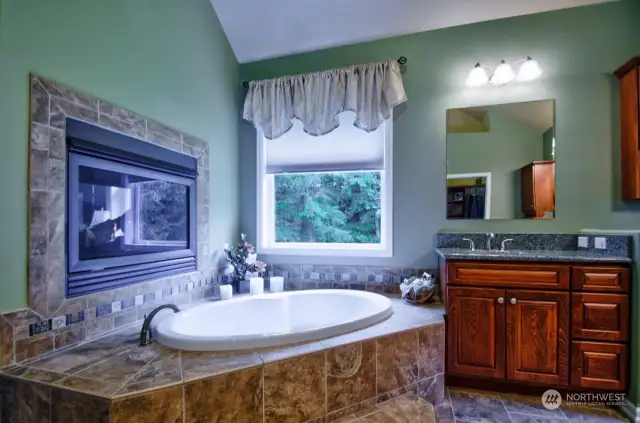 Imagine soaking in this tub, watching the flames of the fireplace for extreme relaxation. 2 separate vanities