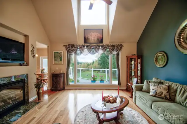 Great room, large windows for enjoying the Mt Rainier view as well as the beautiful surroundings. Sunsetter remote control shades on the outside.