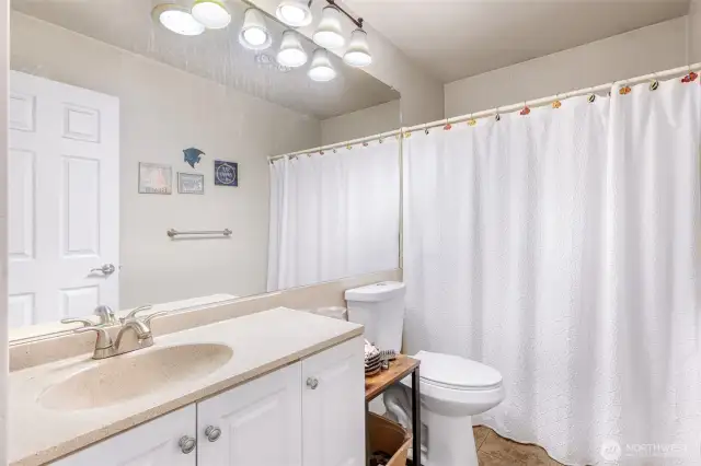 Main bath with combo tub/shower.