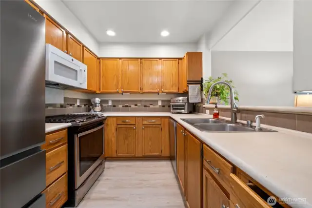 Galley kitchen opens to main living space for easy entertainment