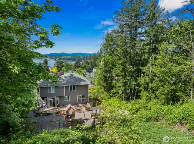 Imagine a cleared, sunny lot with water and mountain views!