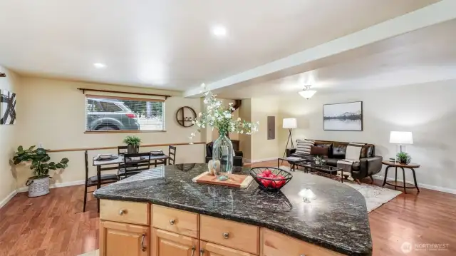 This photo captures the direct view from the kitchen island, showcasing the open flow into the dining area and living room — perfect for social gatherings and everyday enjoyment.
