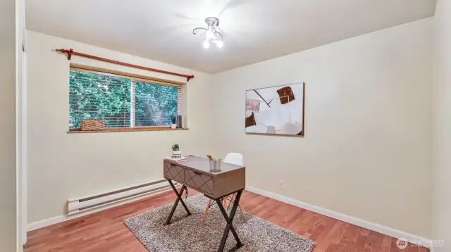 This versatile bedroom with beautiful LVP floors and natural light is ready to adapt — office, nursery, gym, or guest room!