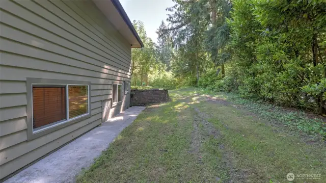 Side yard space ready for your garden, storage, or creative ideas!