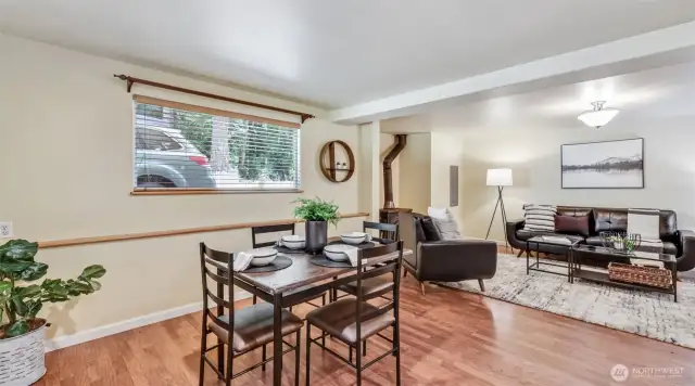 Step into the home on beautiful LVP floors with direct access to the dining area, living room, and kitchen.