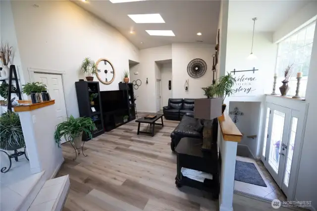 Living room with vaulted ceilings and tons of natural light