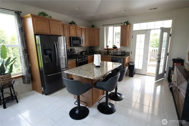 Kitchen with eating space and french doors to large deck.