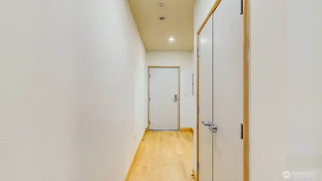 Looking at the front door. Bathroom to the right