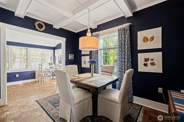 The dining room boasts of a coffered ceiling with a dramatic color pallet to host your formal dinner parties.