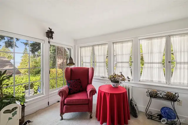 This quaint reading nook extends from the living room to a quieter space to enjoy.