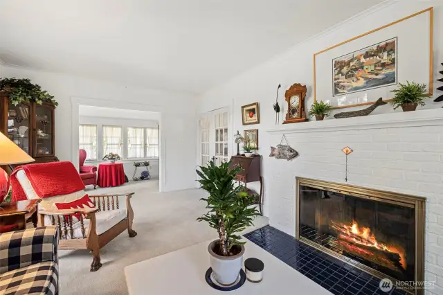 This elegant fireplace with white brick and complementing tile dress up the room nicely.