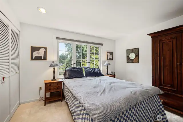 A generous primary bedroom has plenty of room for all your bedroom furniture.