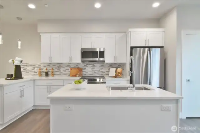 Bright kitchen with large quartz island