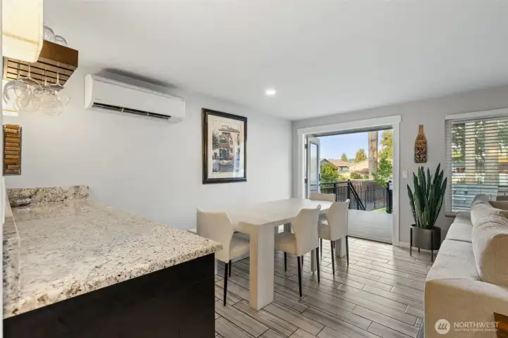 Dining area w/French doors to upper deck