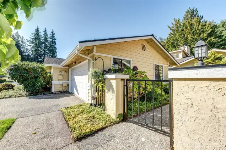 Different angle of front. Entry through the garage directly into the house or this gate.