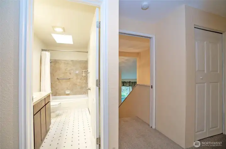 Upper-level landing with an extra closet on the right and the guest bathroom on the left.