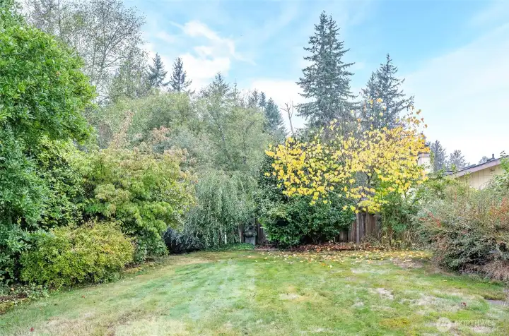 Mature landscaping with the property backing onto a peaceful greenbelt.