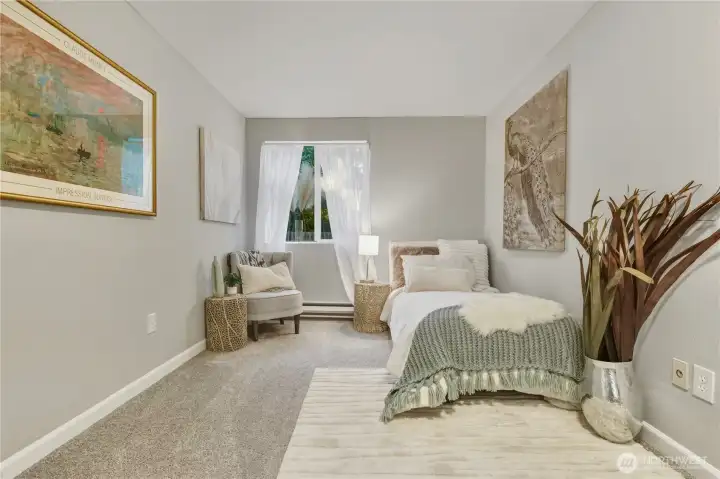 Flexible second bedroom to suit your needs — office, guest room, or additional living space.