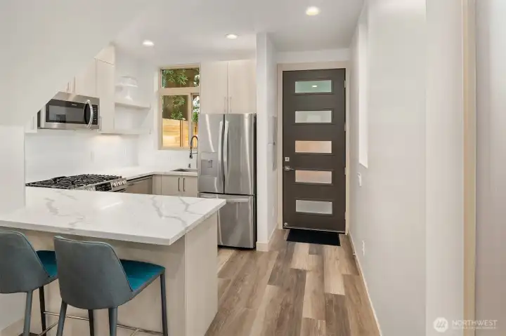 Kitchen area with countertop seating.