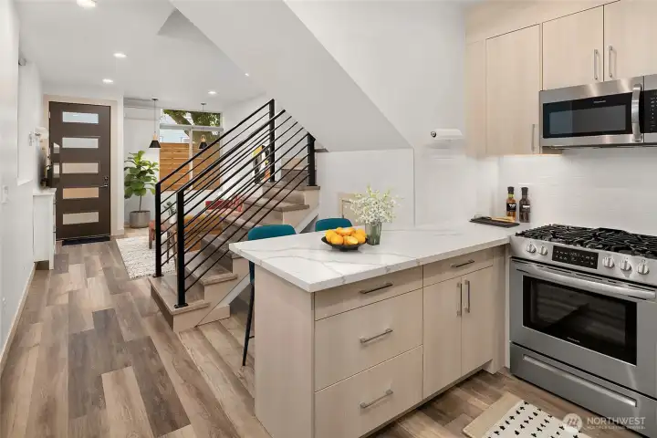 View of main floor from kitchen virtually staged.