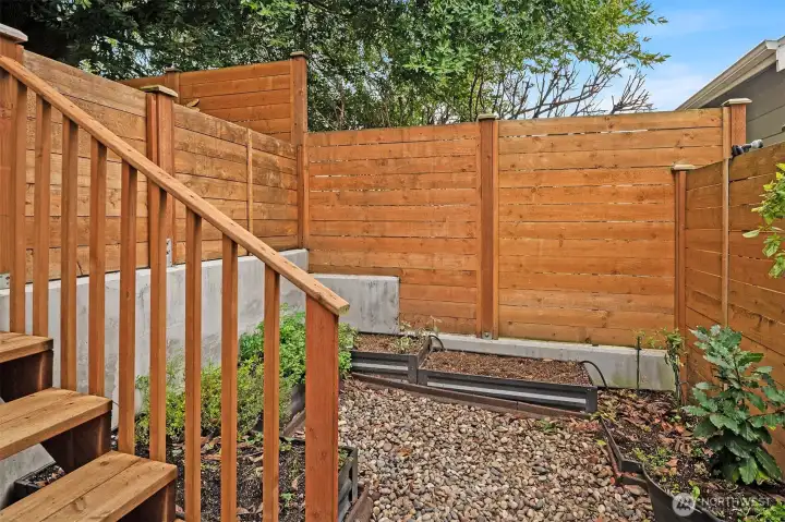 Stairs down to your private gardening area.