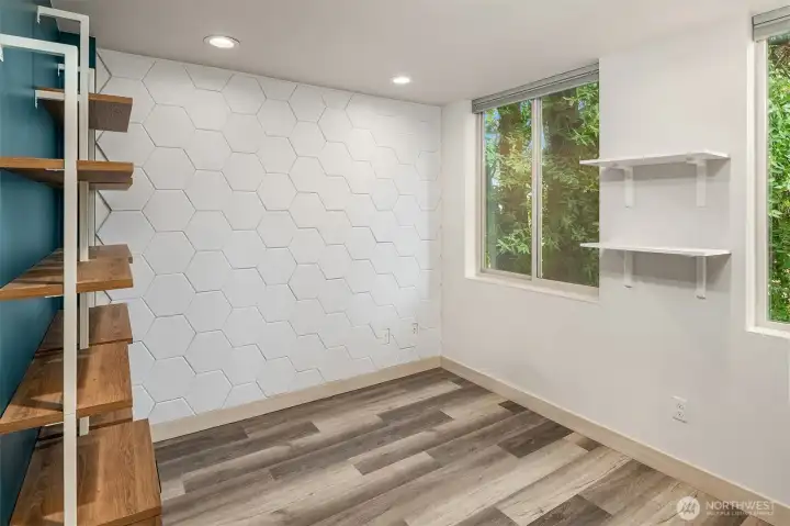 Second floor bedroom with attached shelving. Could serve as an office or bedroom.