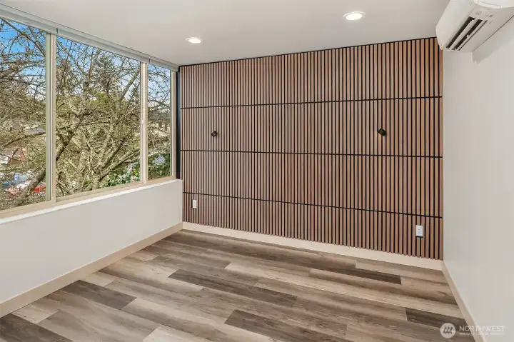 Primary suite on third floor holds a king size bed.