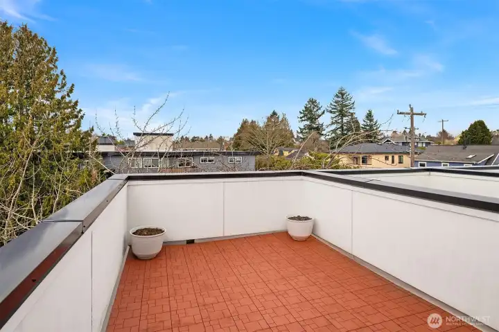Large roof top deck area on the north side of property with sufficient space for table and furniture.