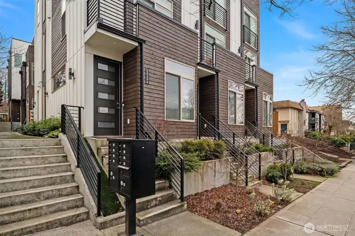 View of street facing units with stairs to access 5616C sitting back from the street.