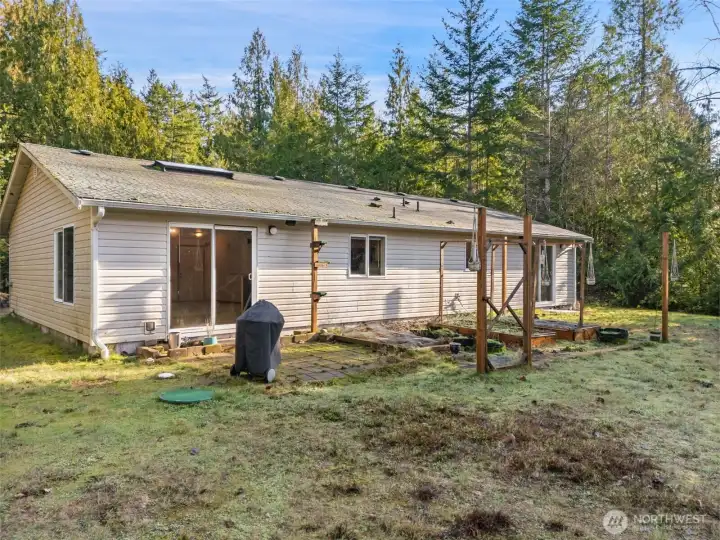 Back of the House with small patio and garden space.