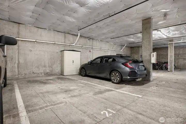 Dedicated parking space located in a secured garage, offering covered parking and added peace of mind.