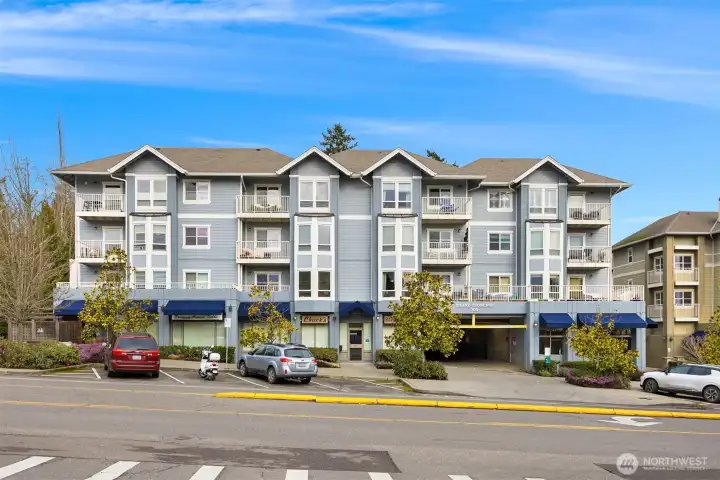 Welcoming exterior with classic Pacific Northwest architecture, covered awnings, and a central location that blends convenience with a peaceful island setting.